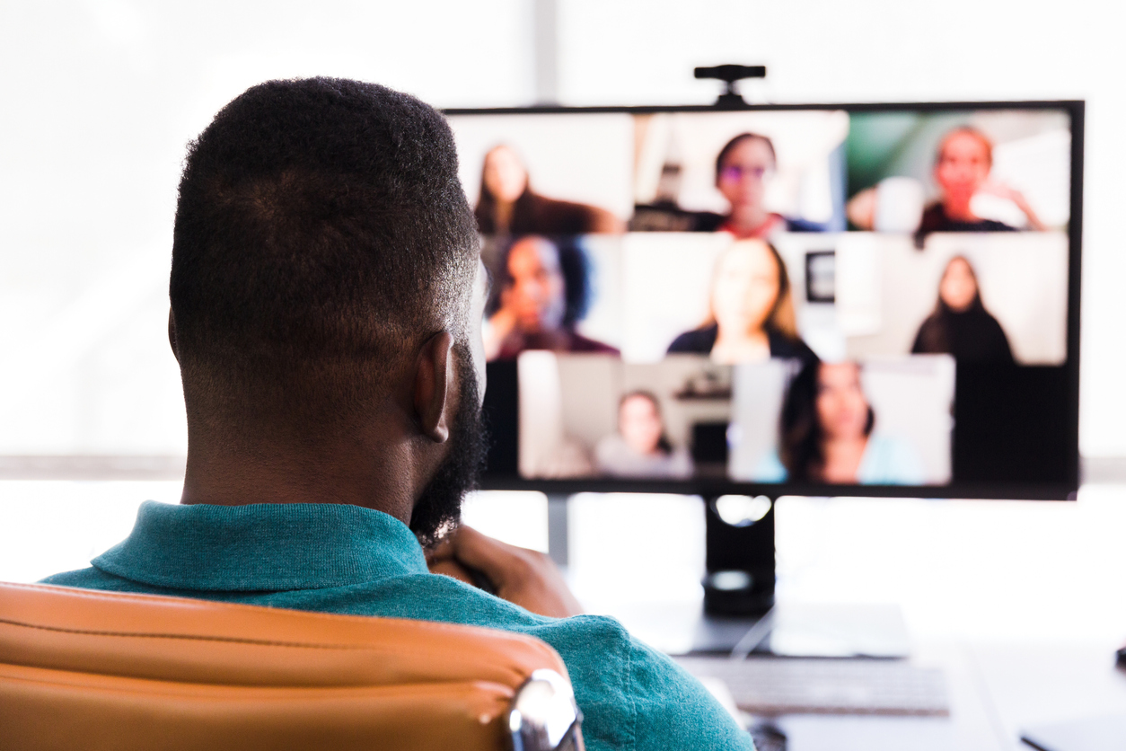 Business people participate in virtual meeting