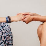 Women Holding Hands