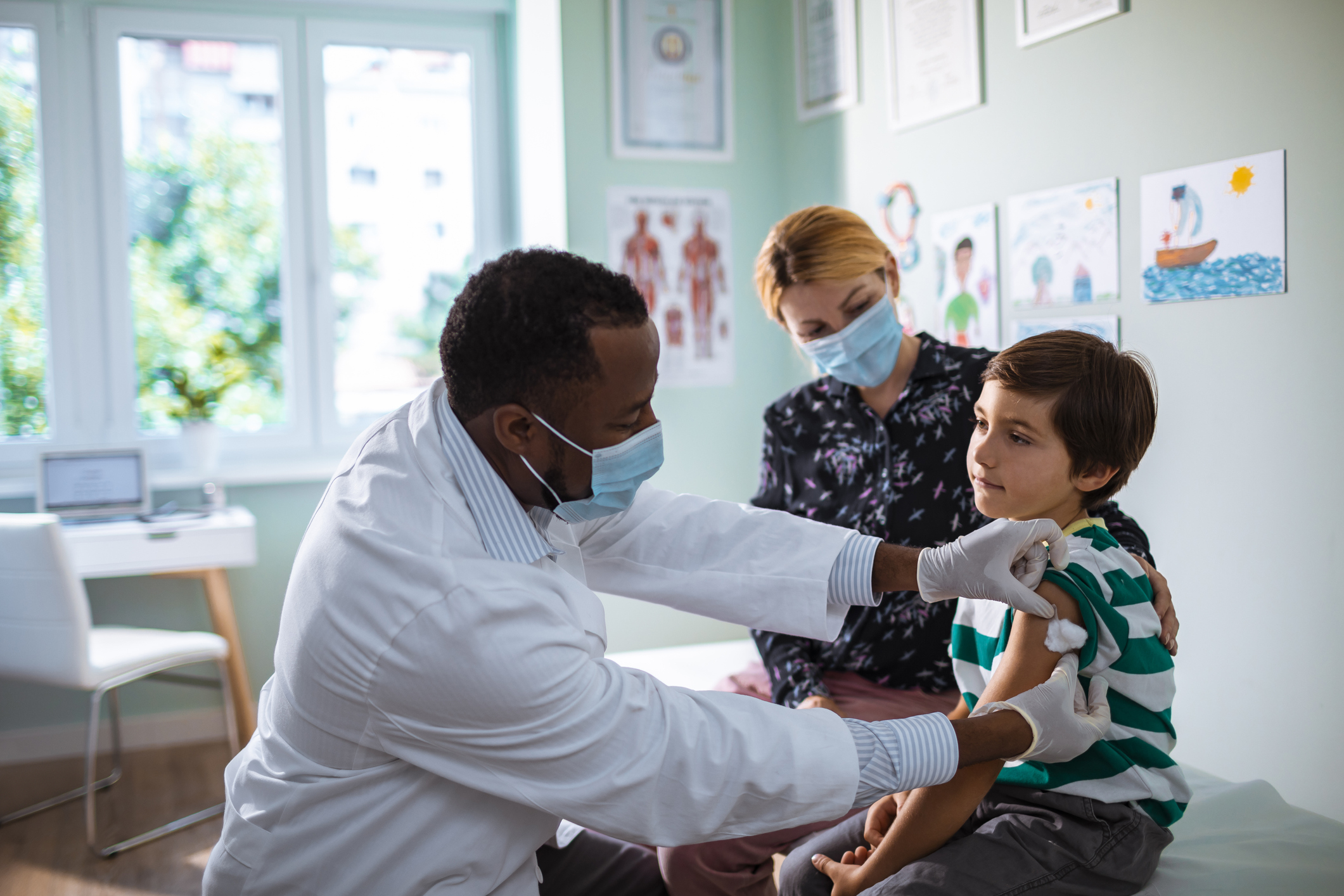 Little boy getting vaccinated at the Pediatrician's office