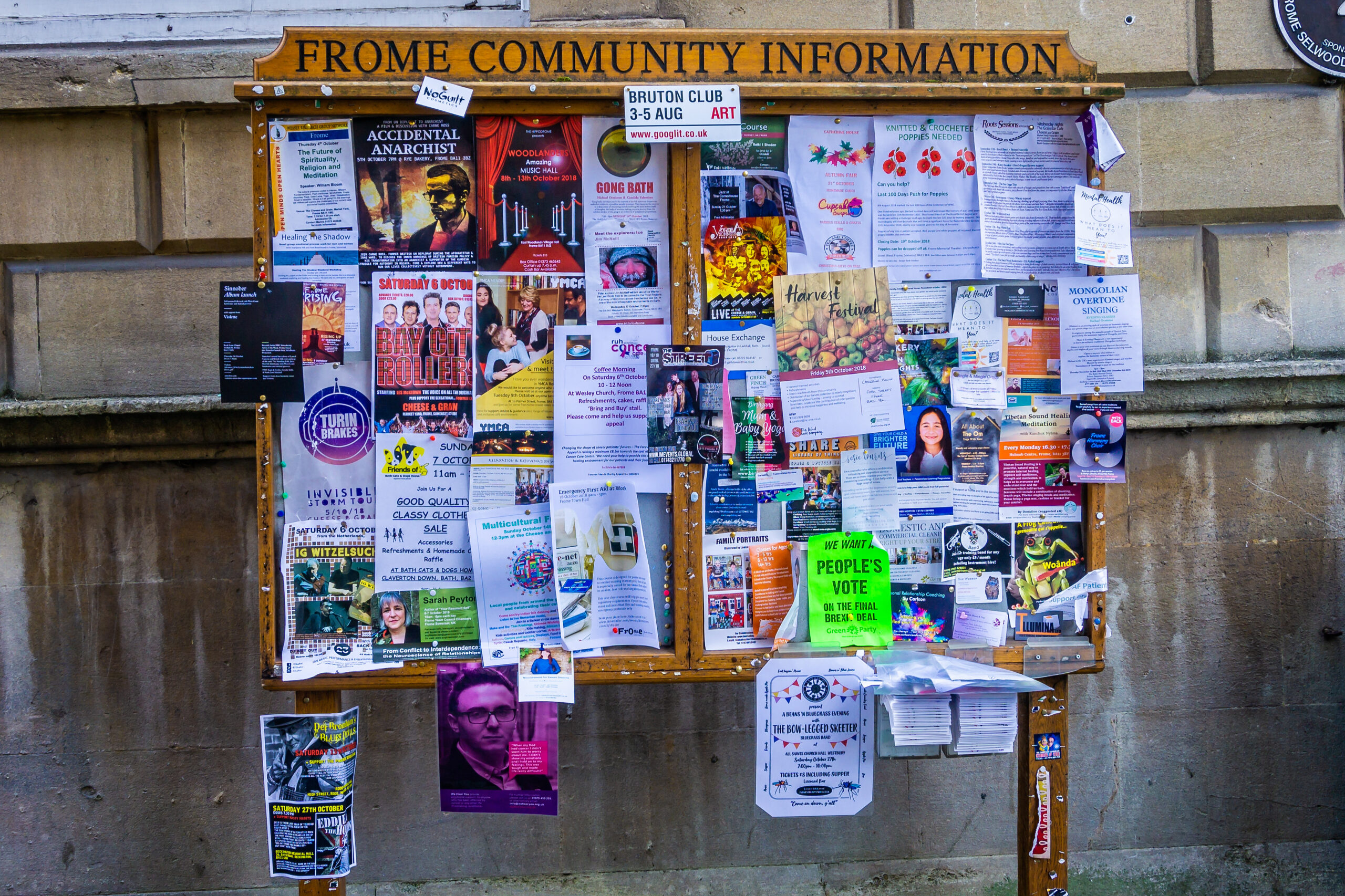 Frome Community notice board covered with leaflets and flyers taken in Frome, Somerset, UK