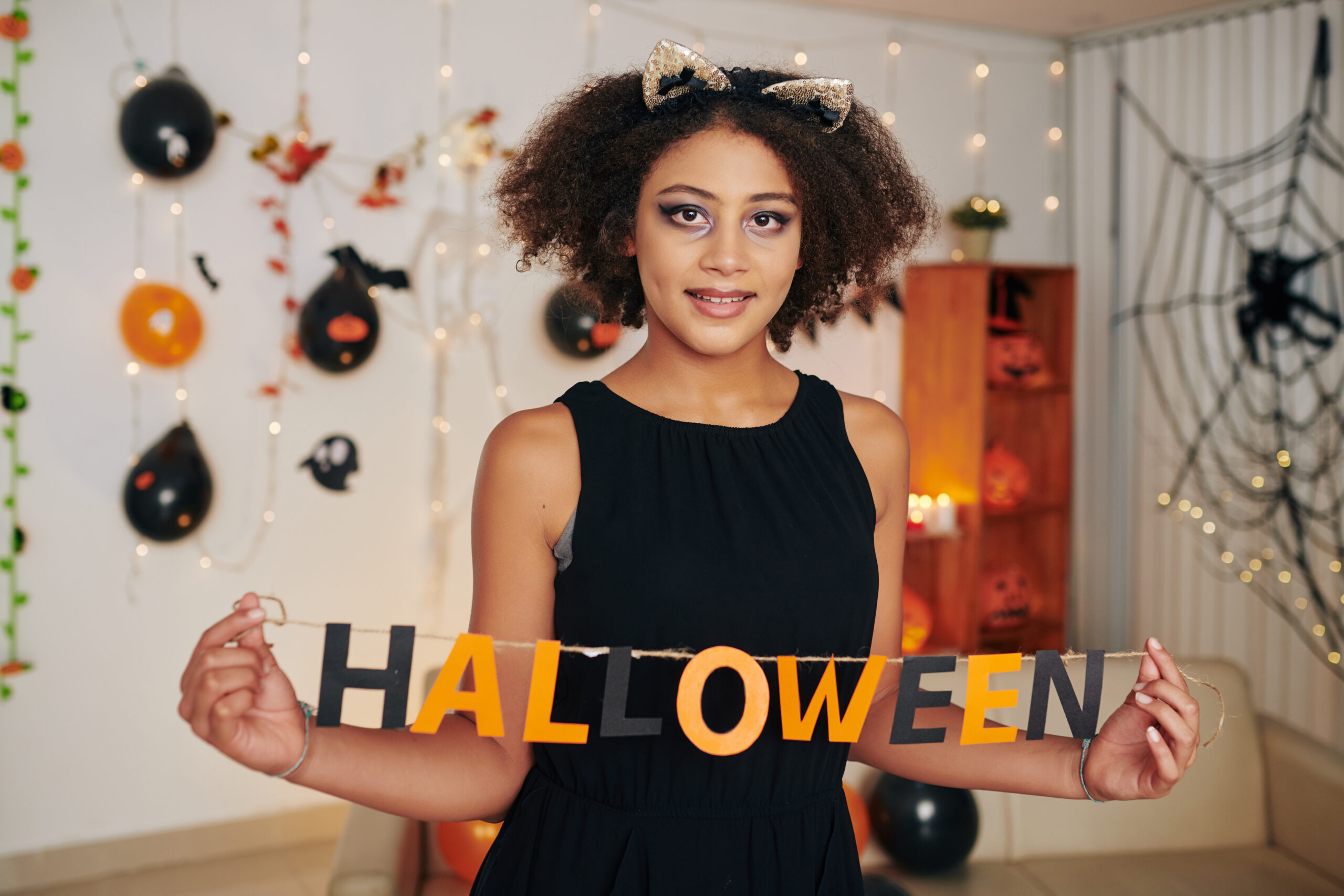 Preteen girl with Halloween letters