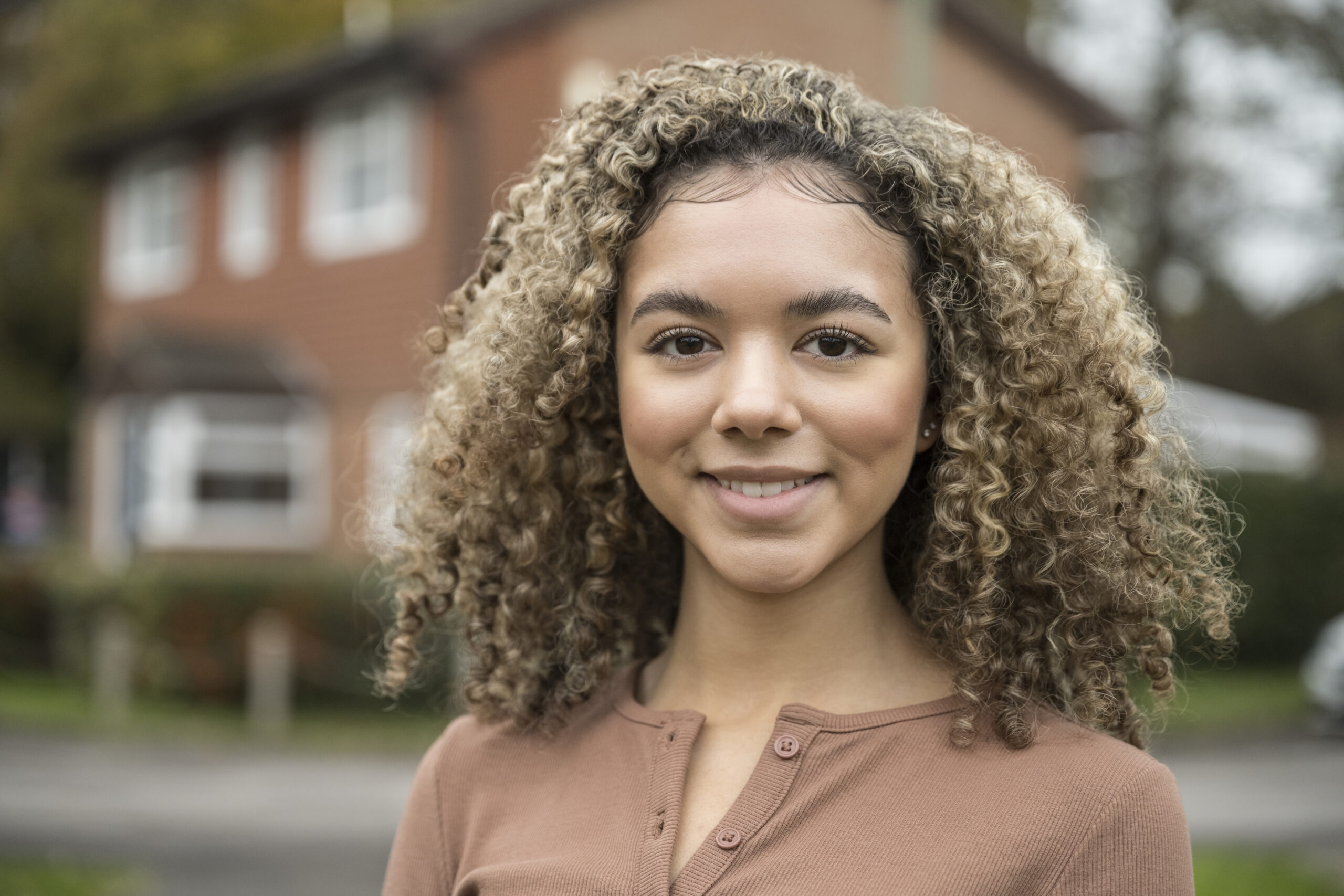 Portrait of cheerful mixed race teenage girl