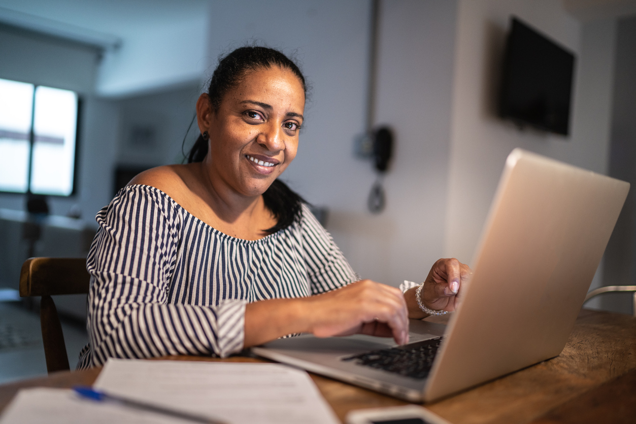 Portrait of a mature woman using laptop at home