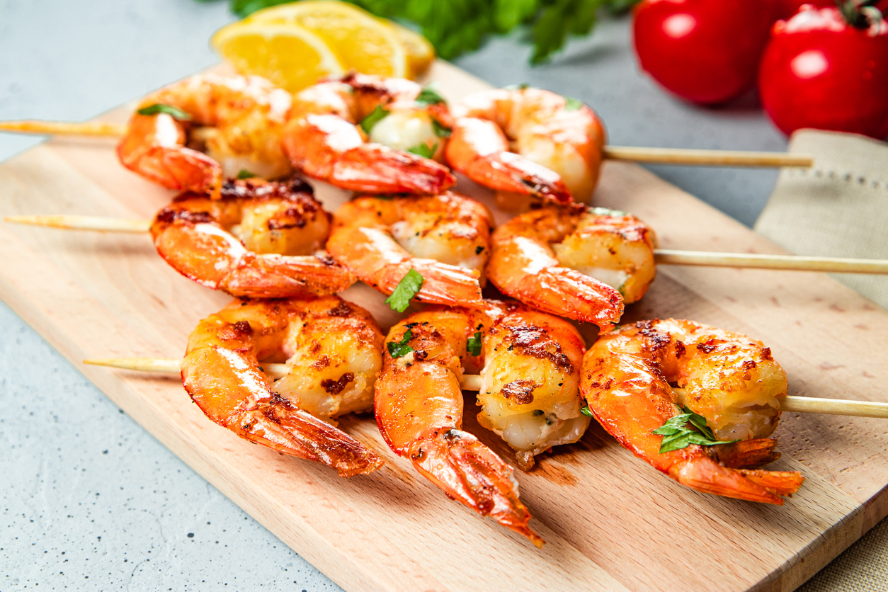 Grilled prawns on wooden skewers, shrimp kebab