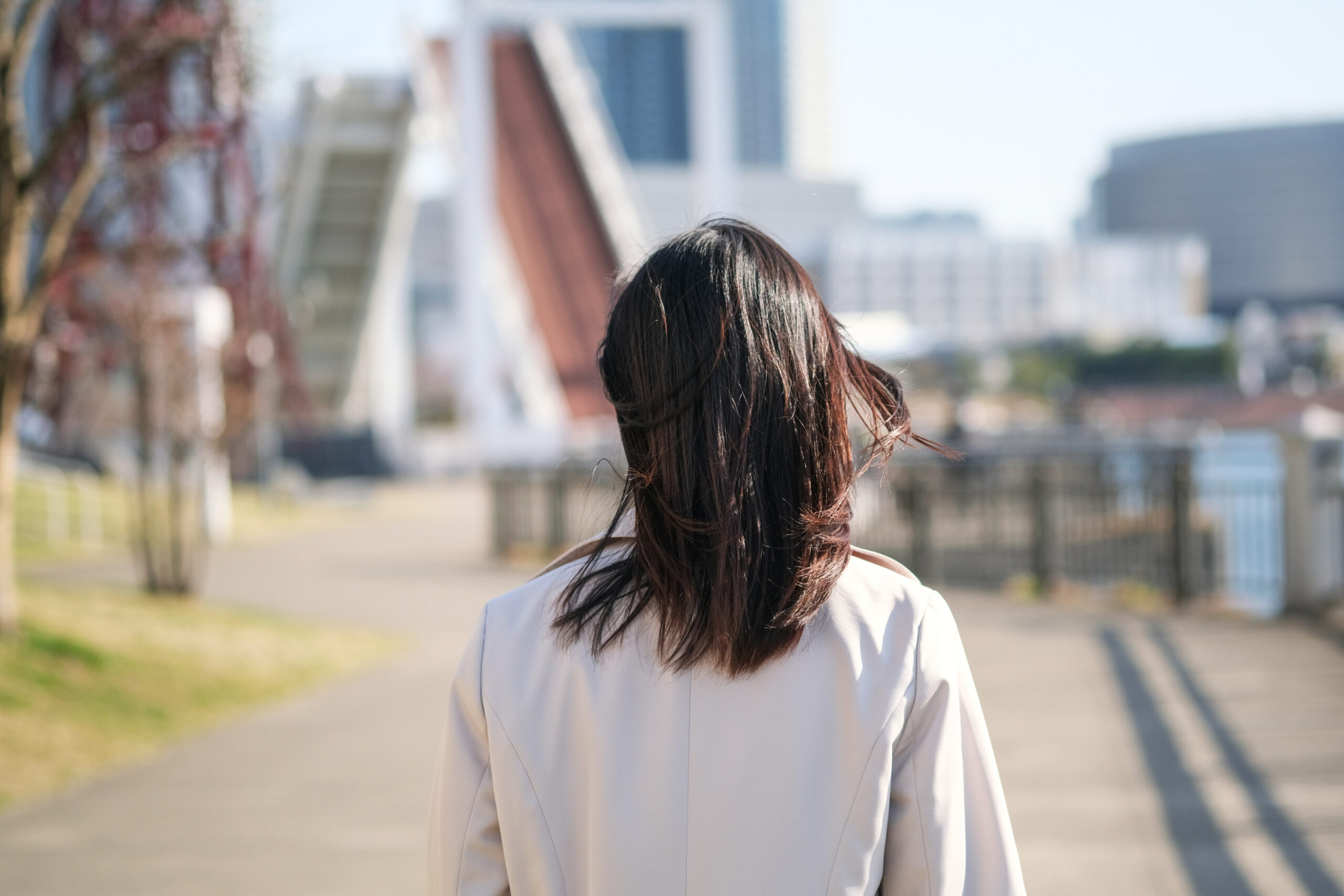 Rear view of businesswoman walking in bay area