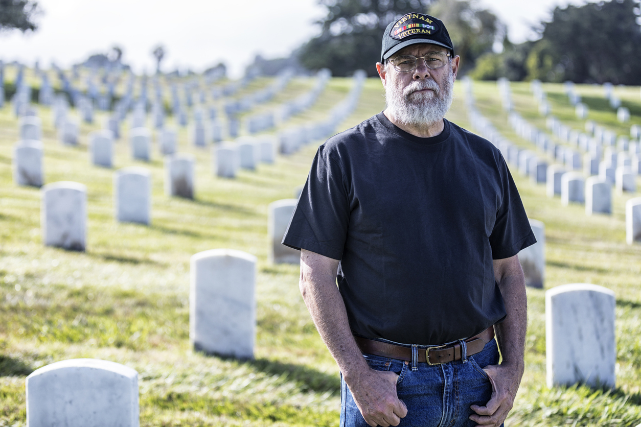 Vietnam War USA Navy Veteran Mourning at Military Cemetery