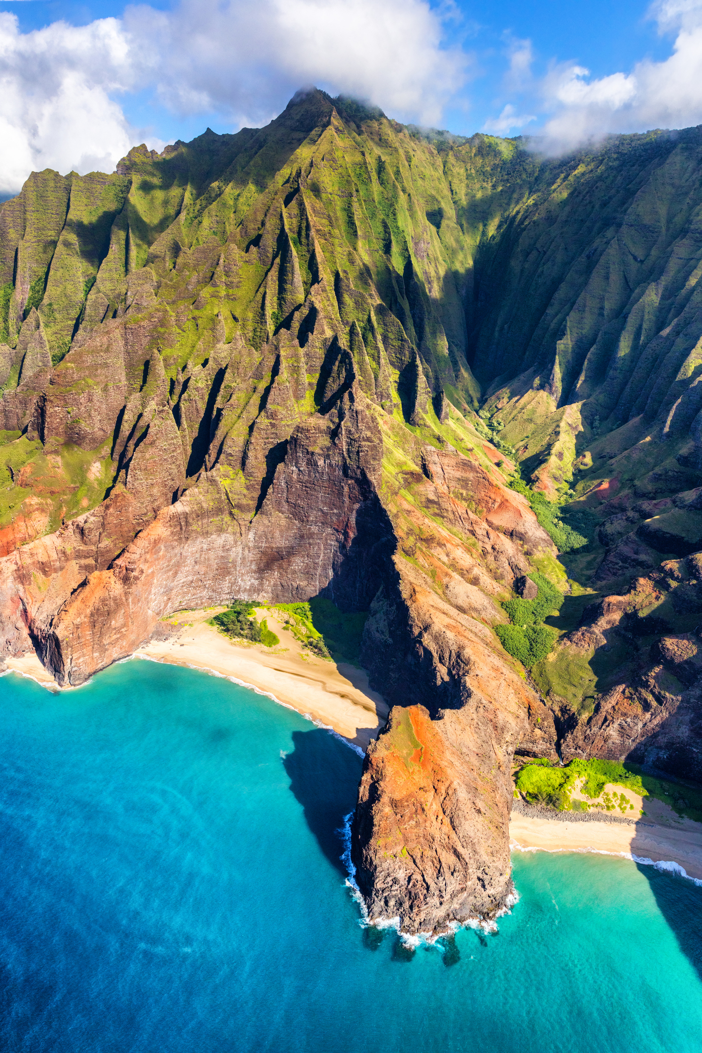 Hawaii beach, Kauai. Na pali coast view from helicopter. Hawaiian travel destinaton. Napali coastline in Kaui, Hawaii, USA. Aerial of Honopu arch