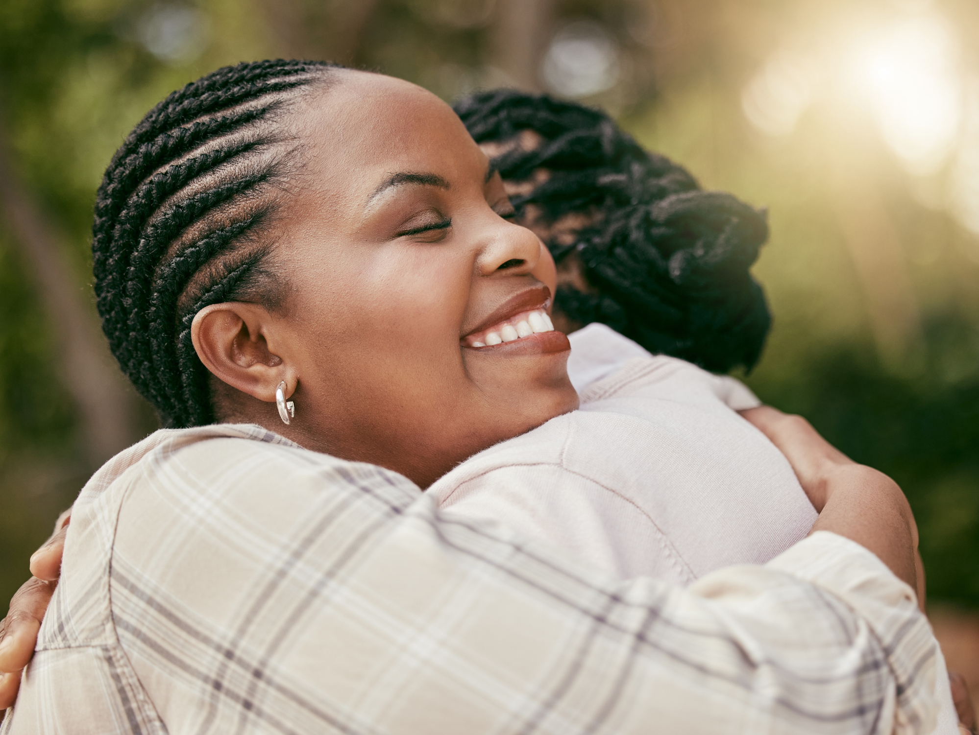 Shot of a mother and daughter embracing at home