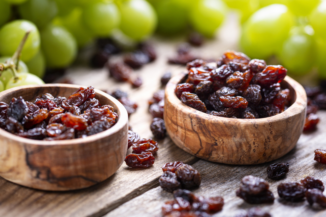 Raisins and grapes - wooden bowl