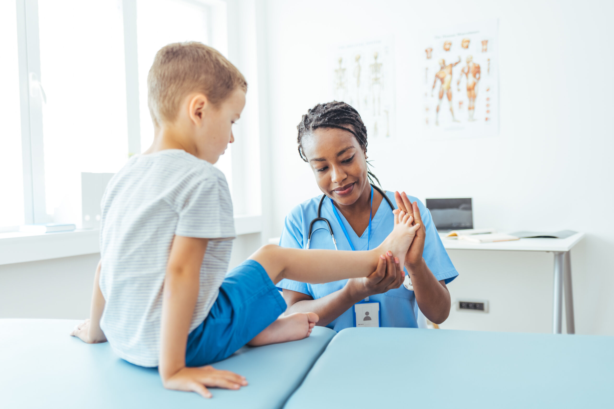 Medical Checkup: a Doctor Examining a Boy at her Office