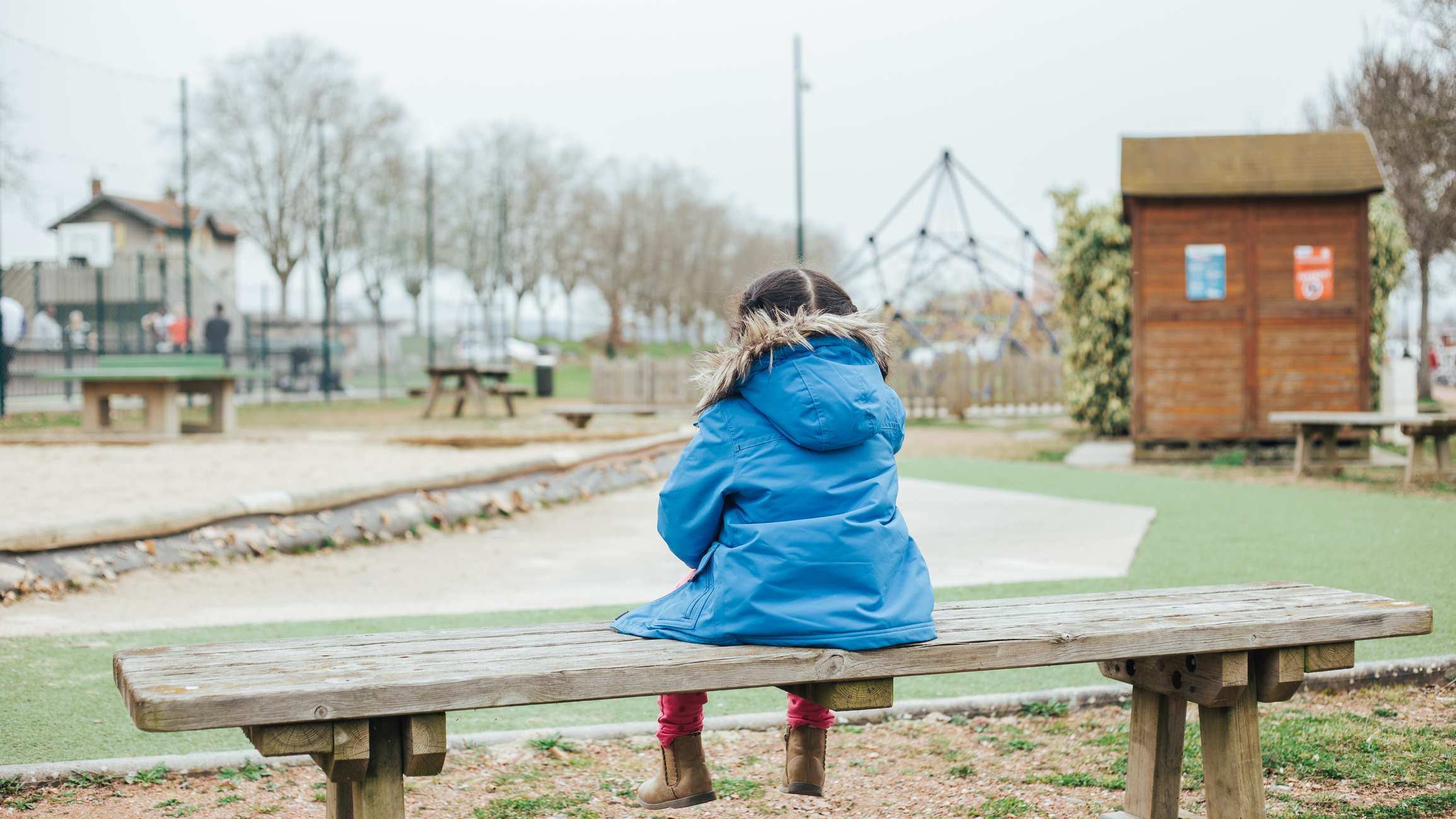 girl on bench iStock-1454003967