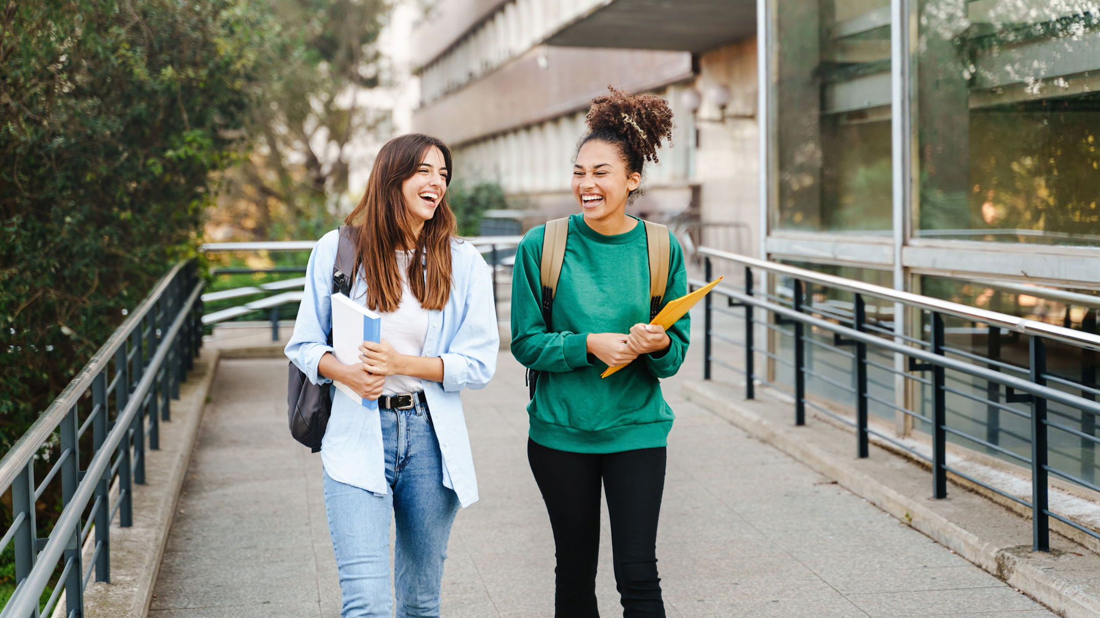 Two college girls walking and talking