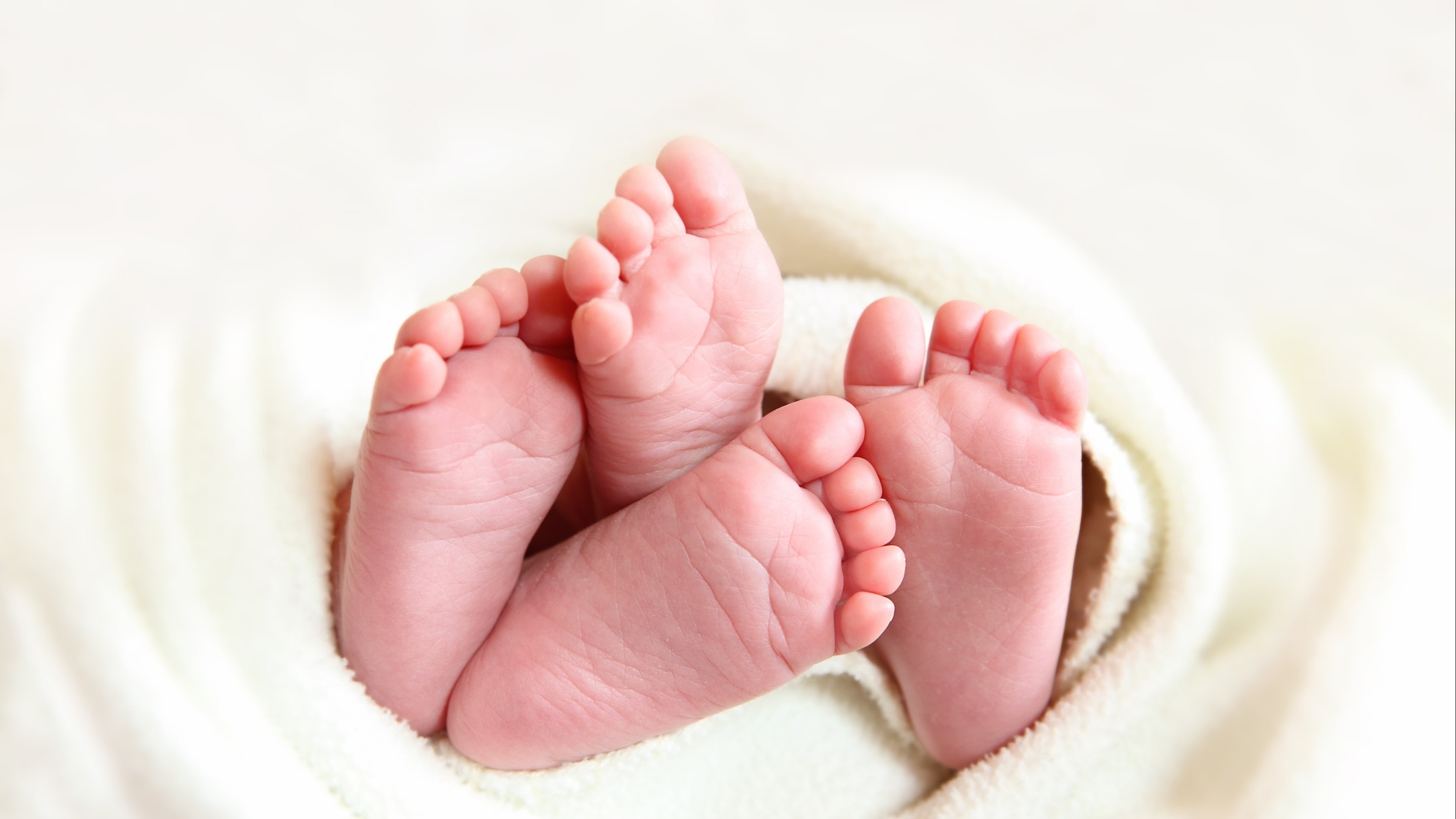 Newborn twin feet