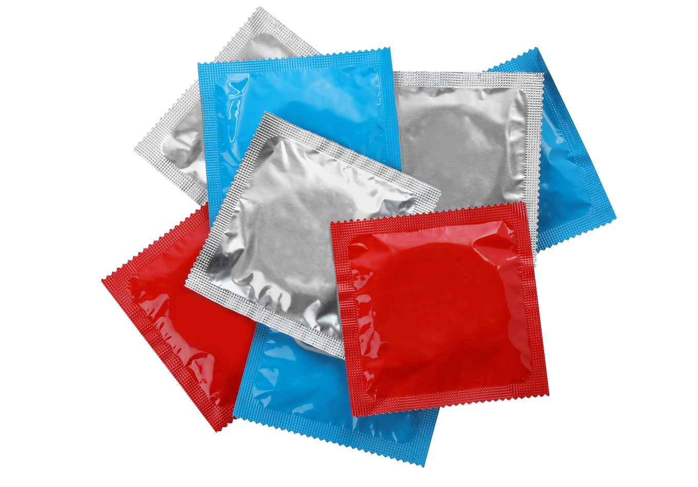 Condom packages isolated on white, top view. Safe sex