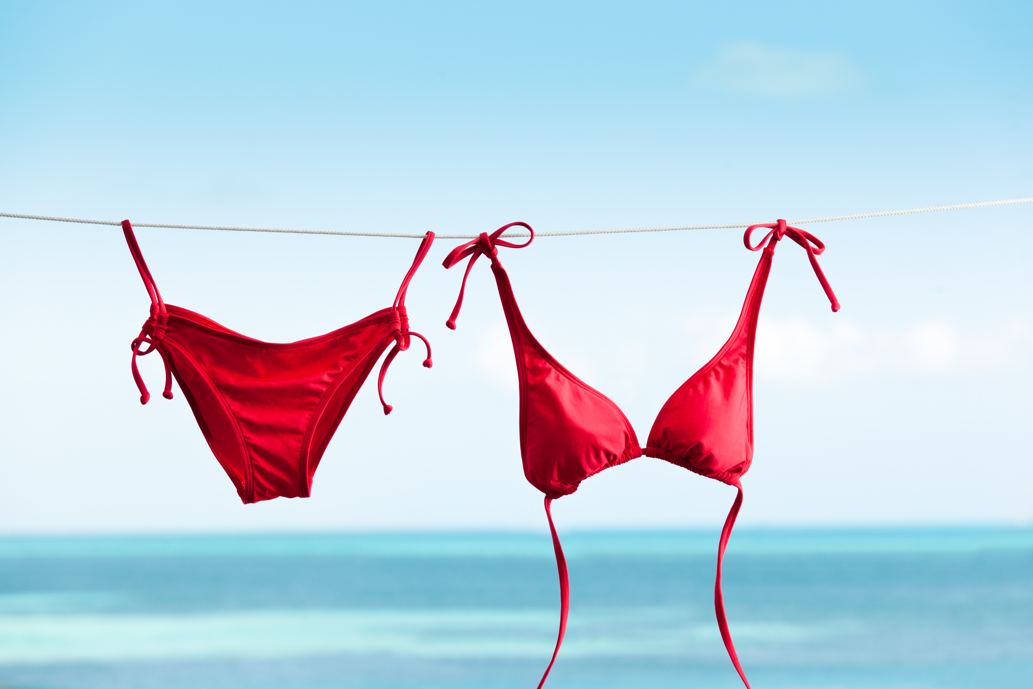 Tropical Beach Vacation with Bikini Swimwear Drying on Clothes Line