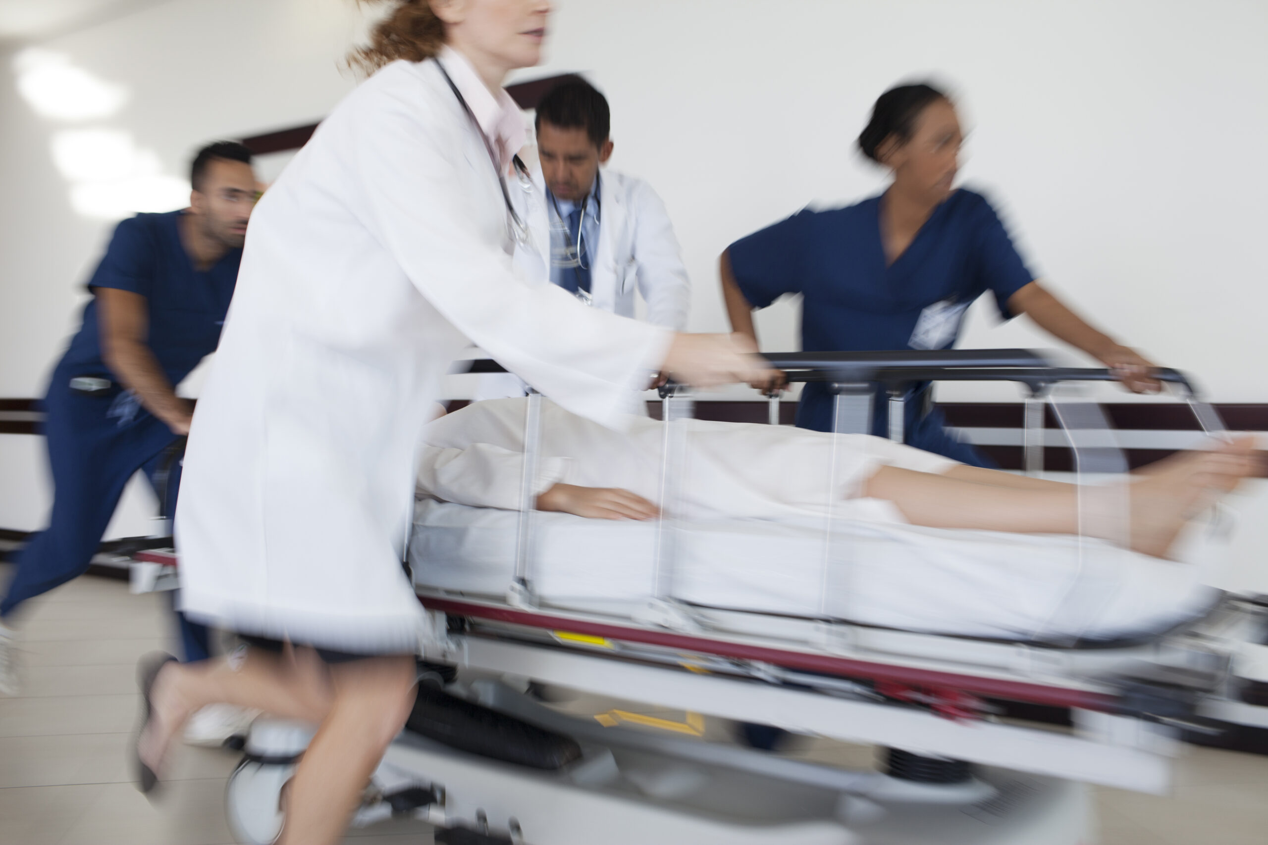 Hospital staff rushing patient to operating room