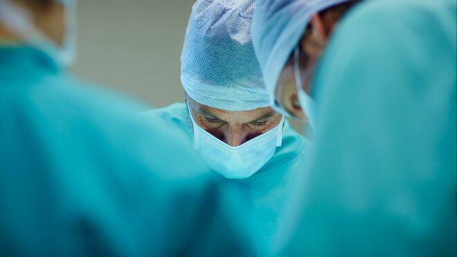 Surgeons performing in operating room