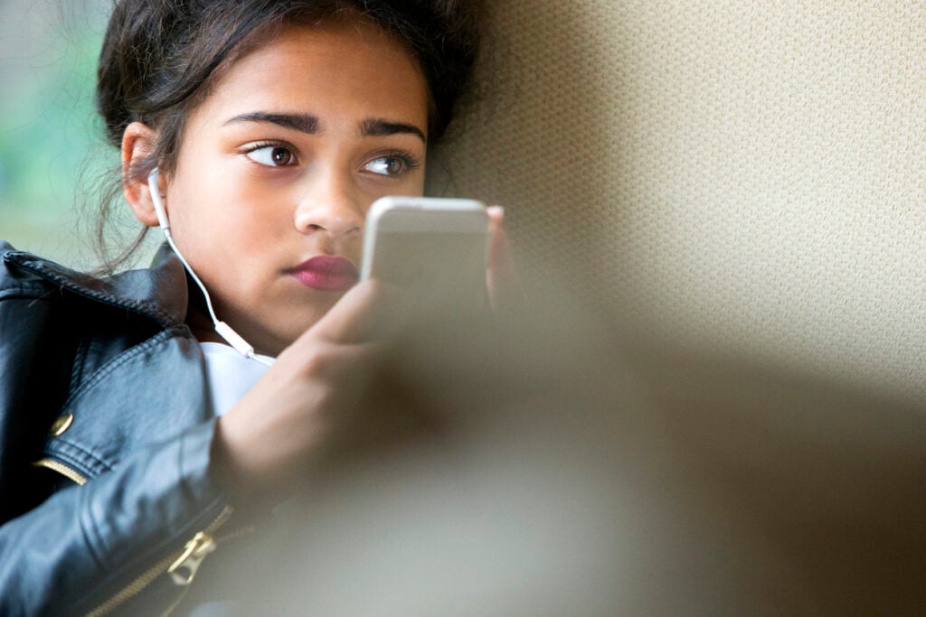 Teenager on her cellphone