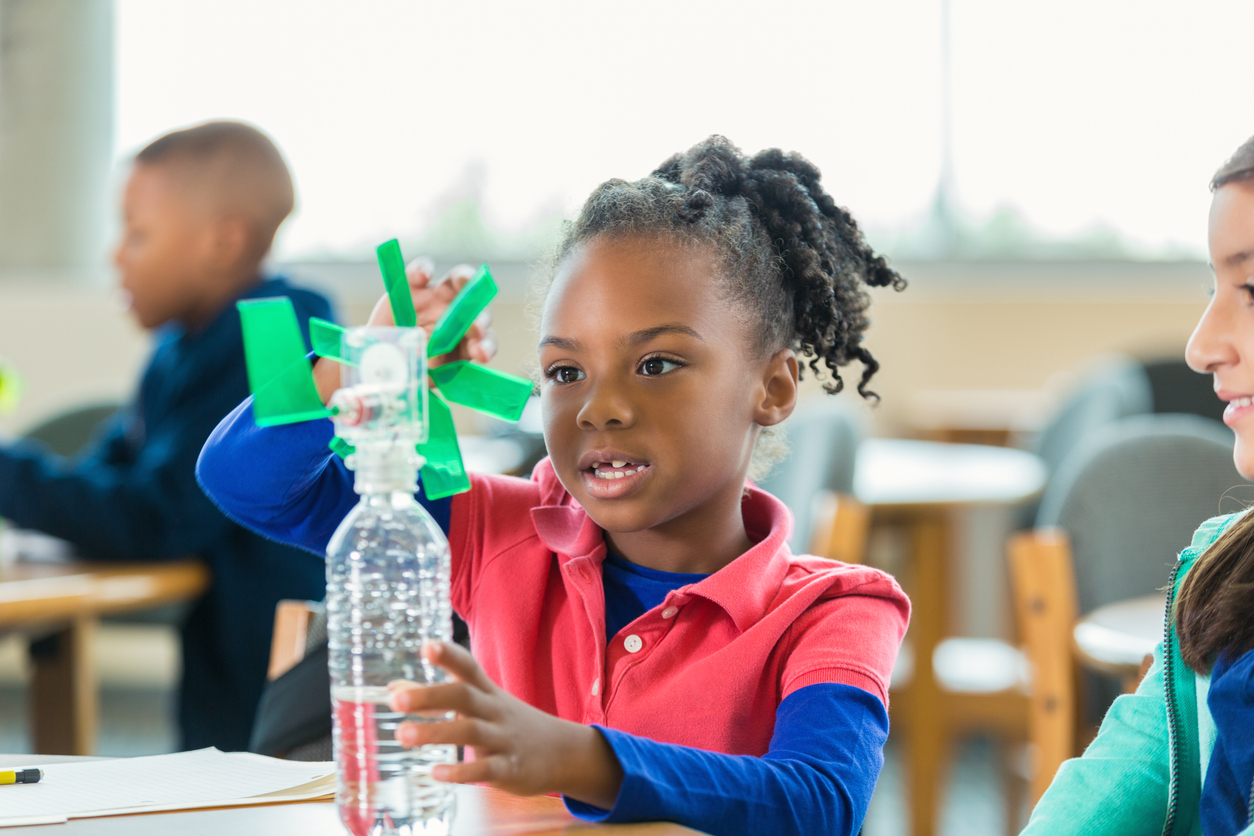 Students studying alternative wind energy during elementary science class