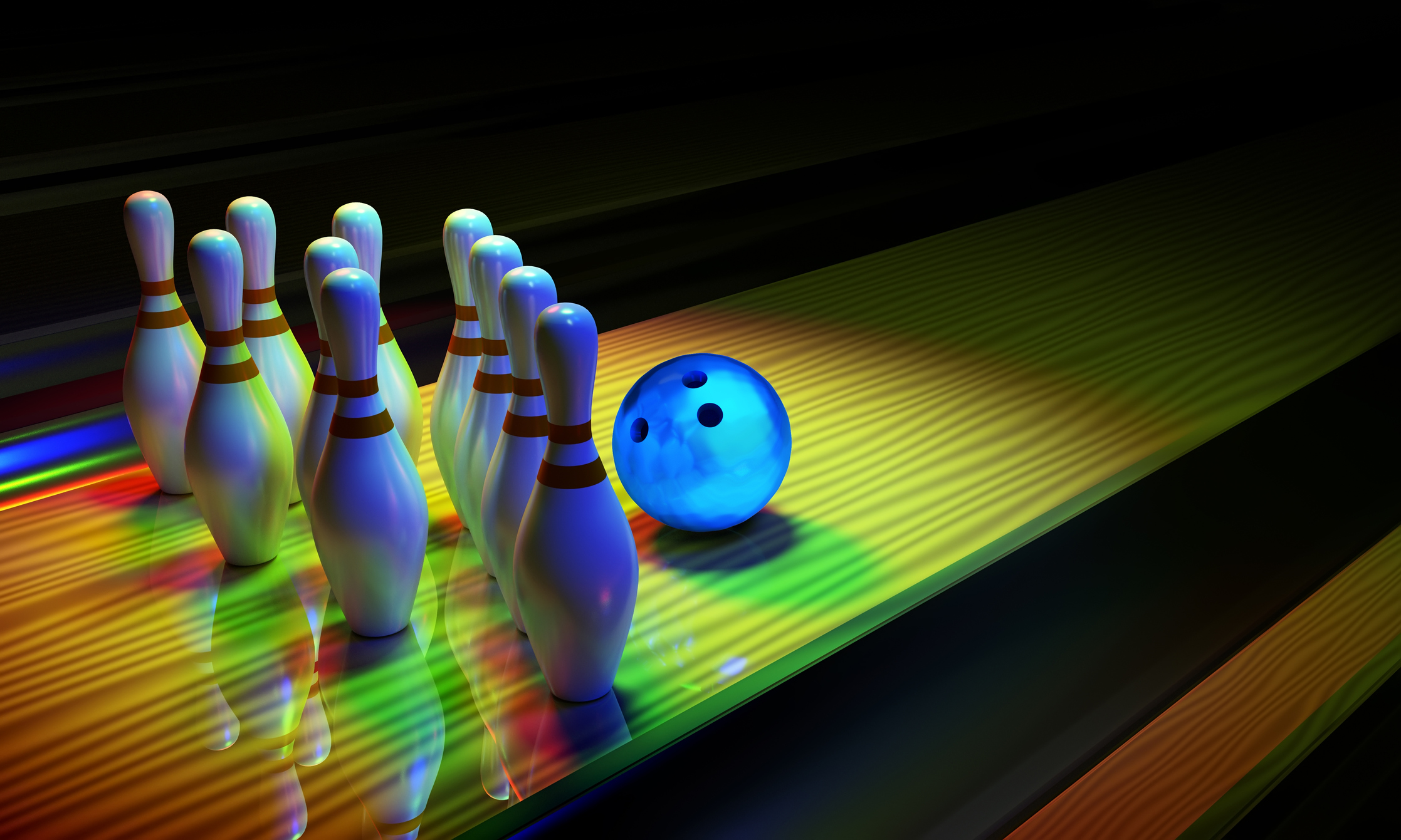 Bowing ball and skittles on the alley.