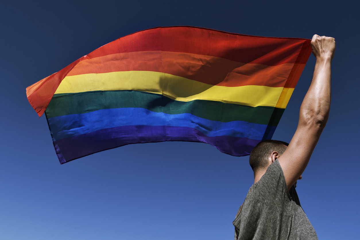 man with a rainbow flag