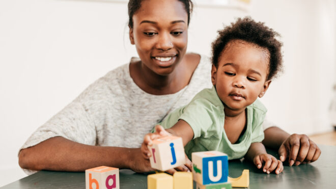 Mom And Toddler Play With Blocks