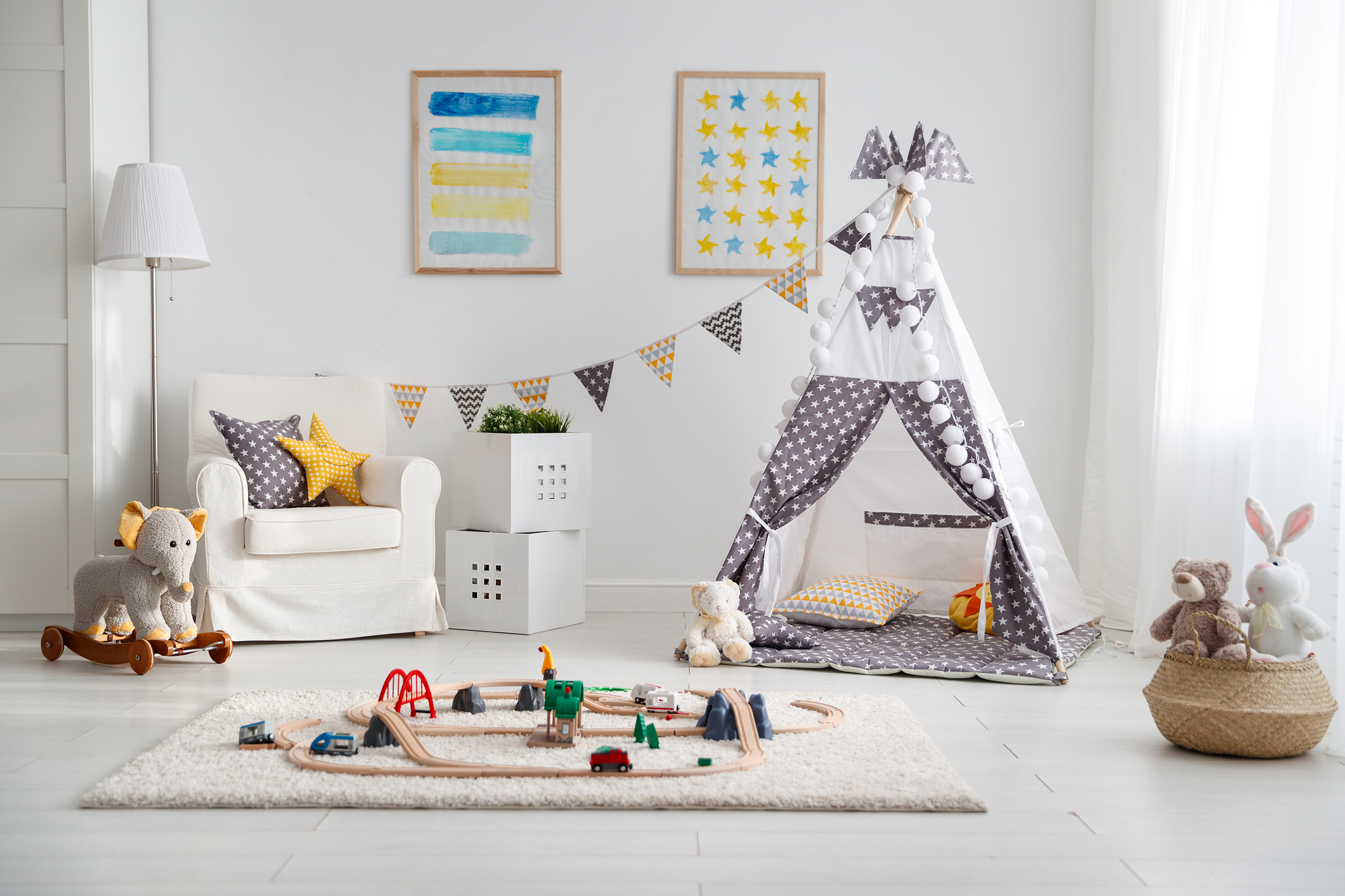 empty children's playroom with  tent and  toy railway