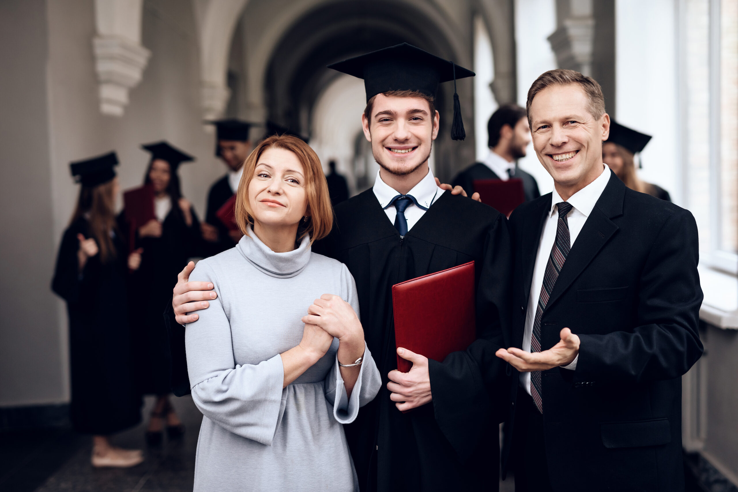 Parents congratulate the student, who finish their studies at the university.