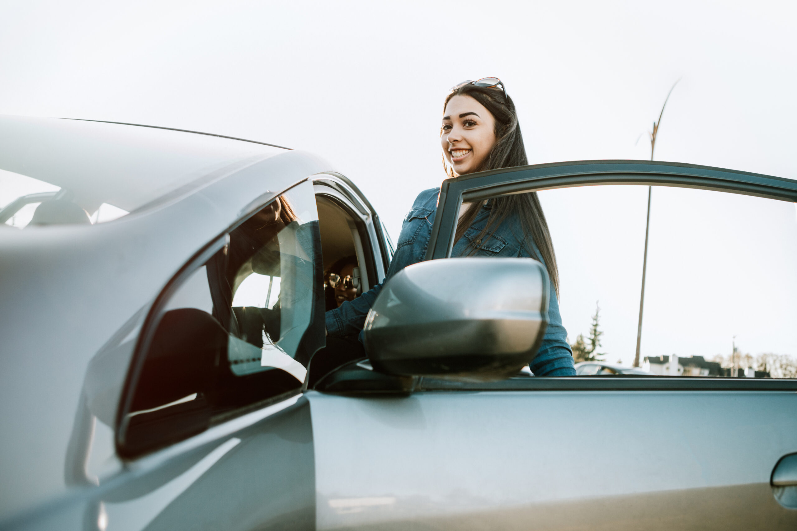 Group of Young Adults Having Fun Riding in Car