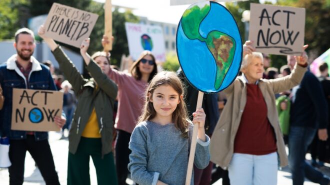 People with placards and posters on a global strike for climate change.