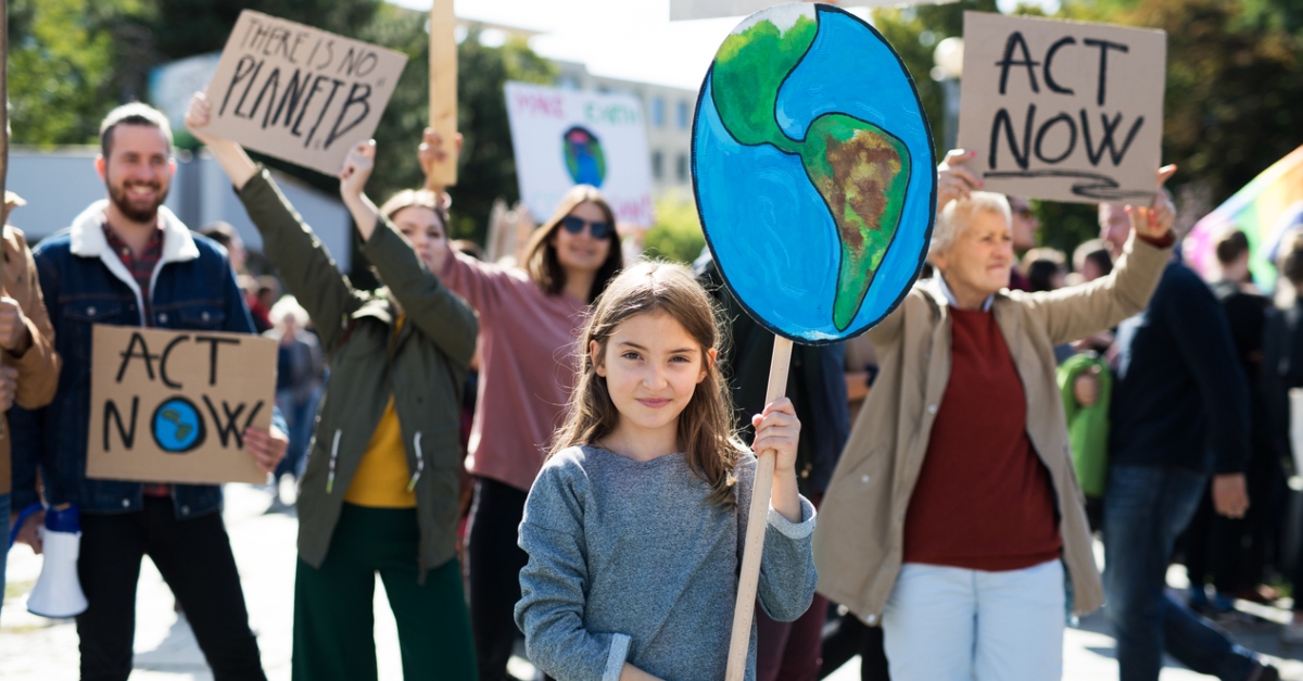 People with placards and posters on a global strike for climate change.