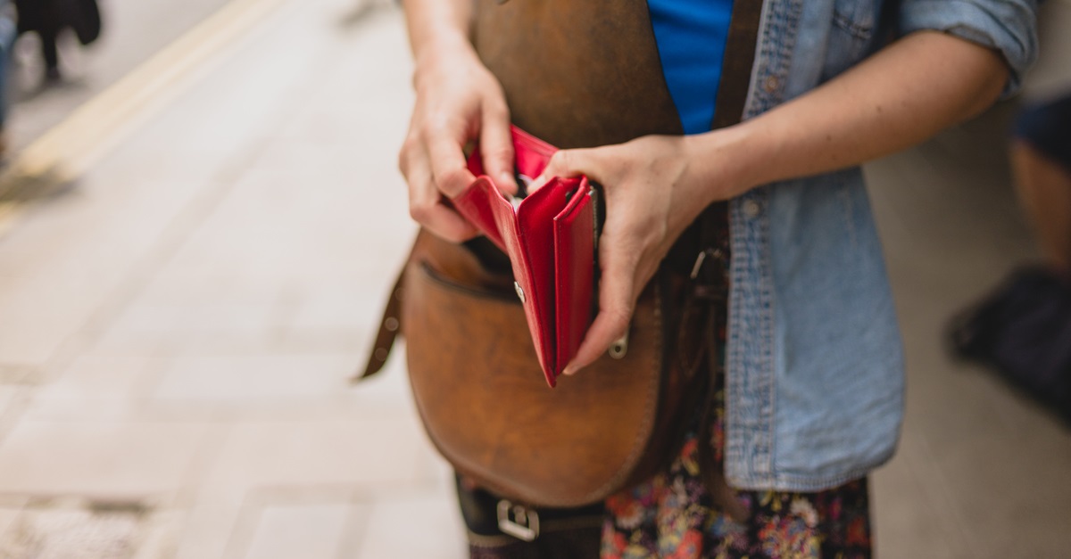 Young woman with purse in the street