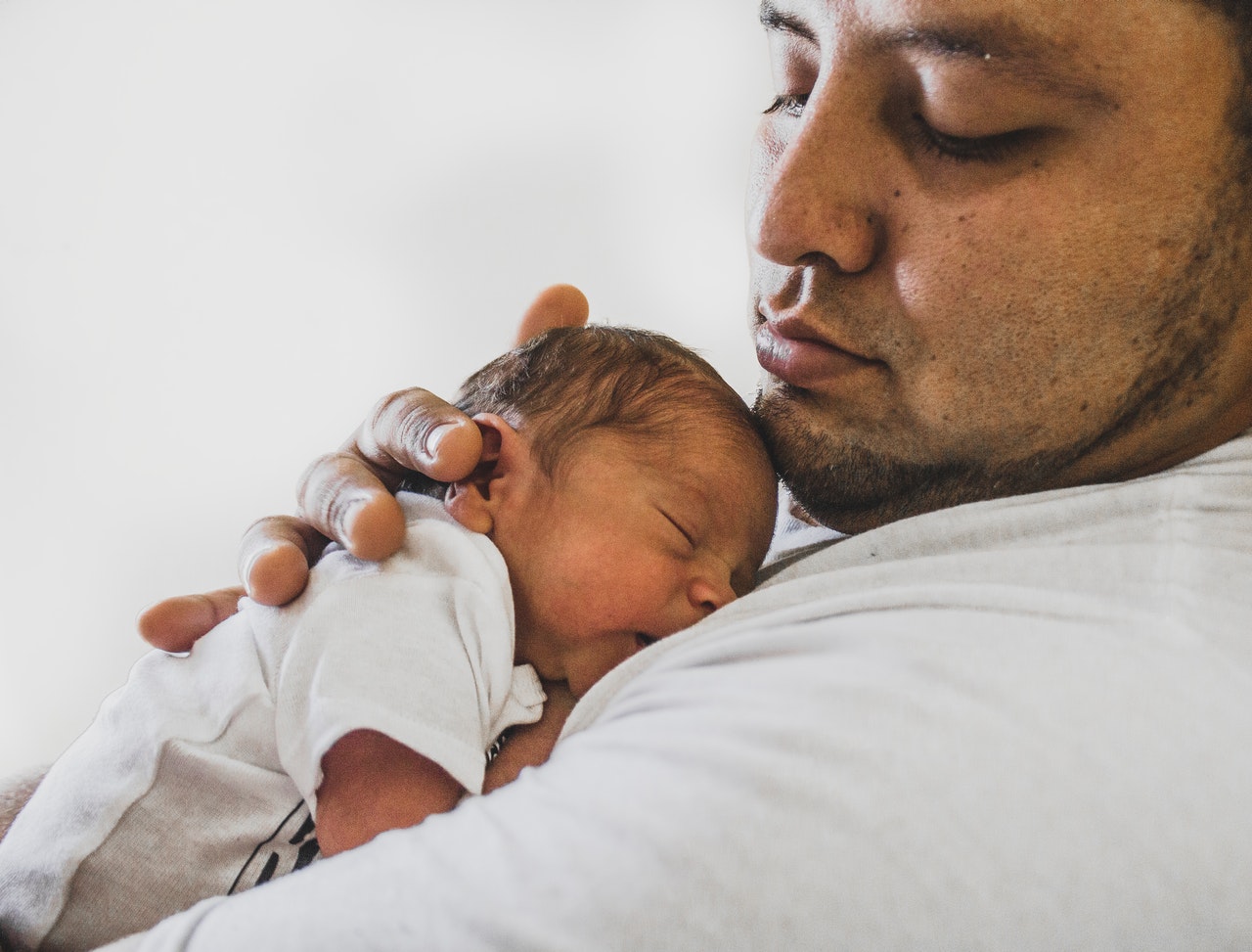 photo-of-father-carrying-newborn-baby-3617855-1.jpg