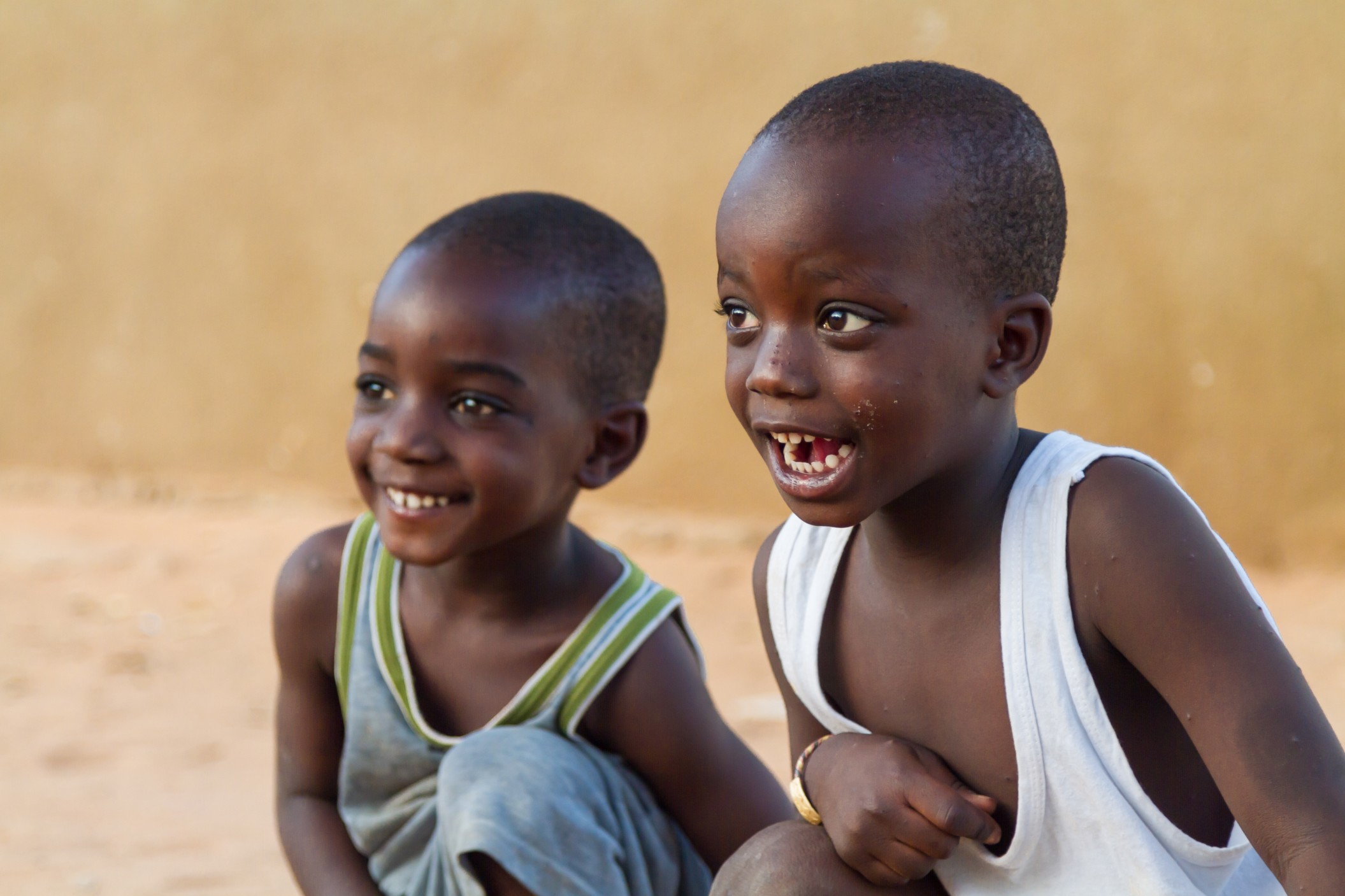 senegalese-boys-laughing-young-senegalese-boys-laughing-and-playing-outside-on-a-dusty-senegalese_t20_xXlj2l.jpg