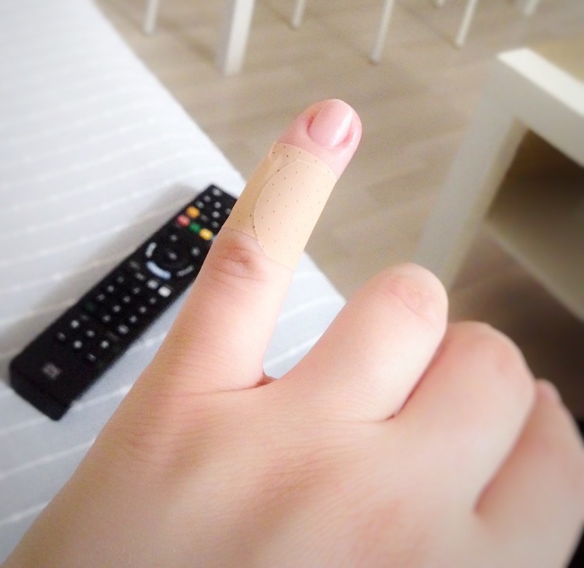 the-little-finger-of-a-female-with-a-band-aid_t20_AlOY4V.jpg