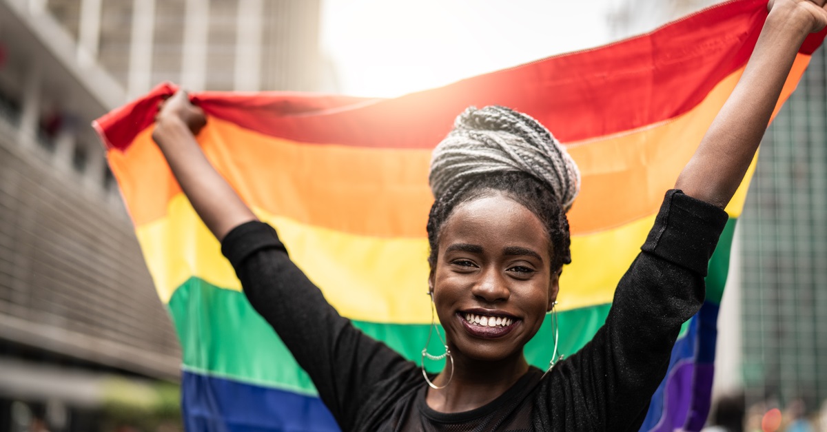 Woman Waving Rainbow Flag at Gay Parade