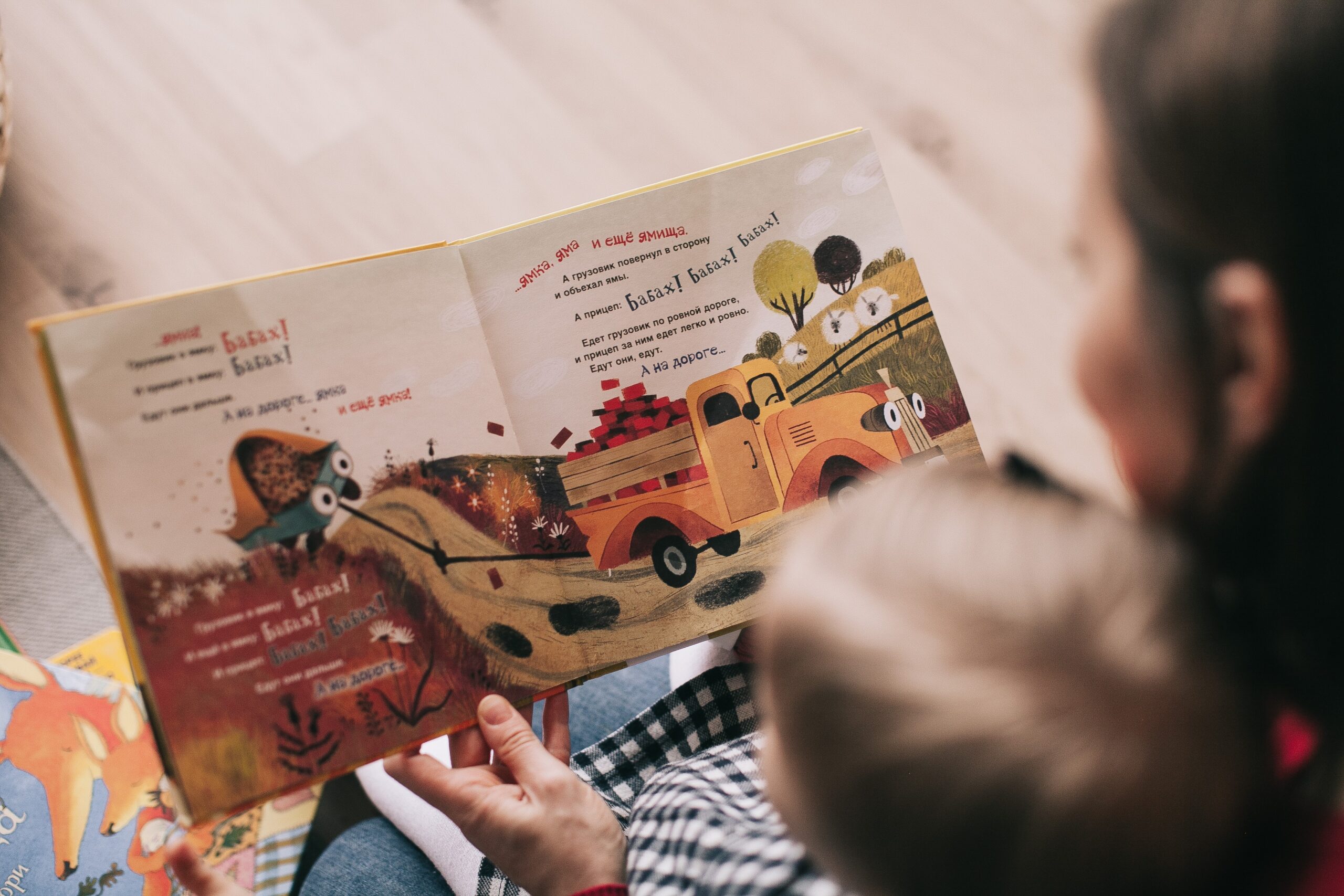 woman-reading-book-to-toddler-1741231.jpg