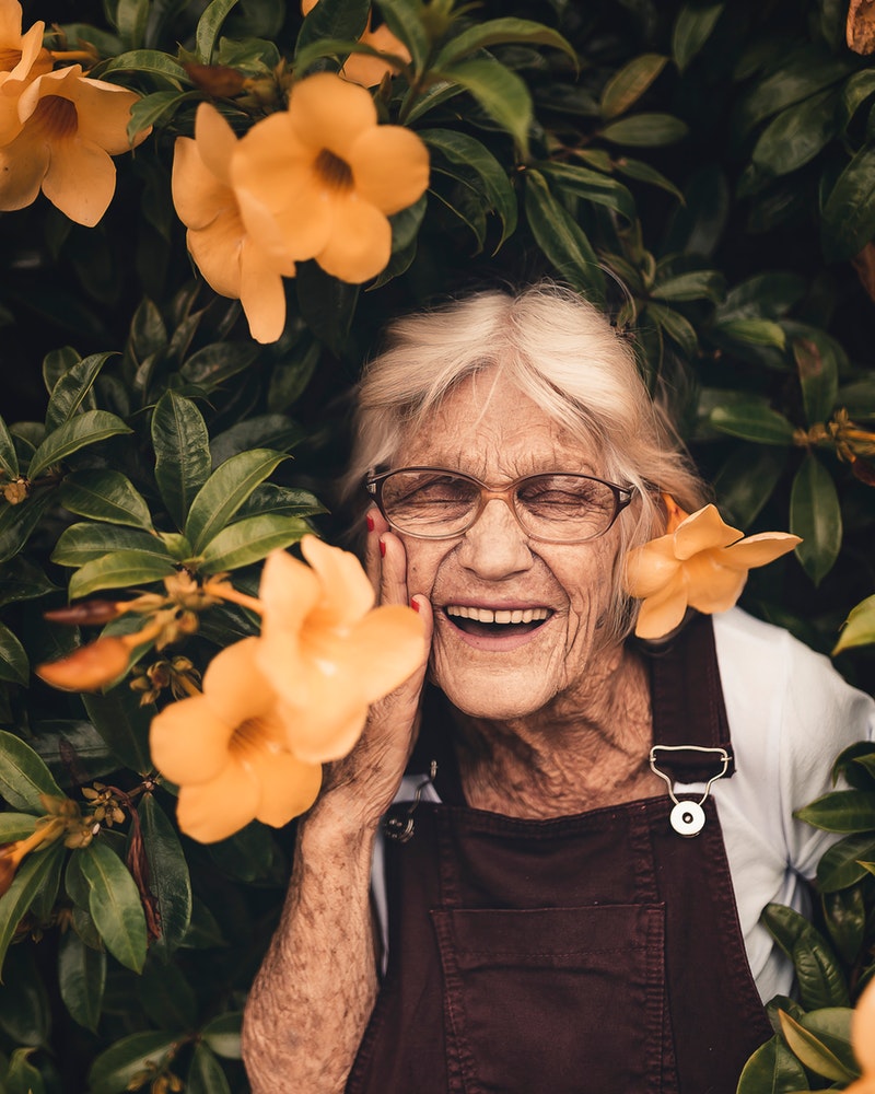 woman-standing-near-yellow-petaled-flower-2050994.jpg