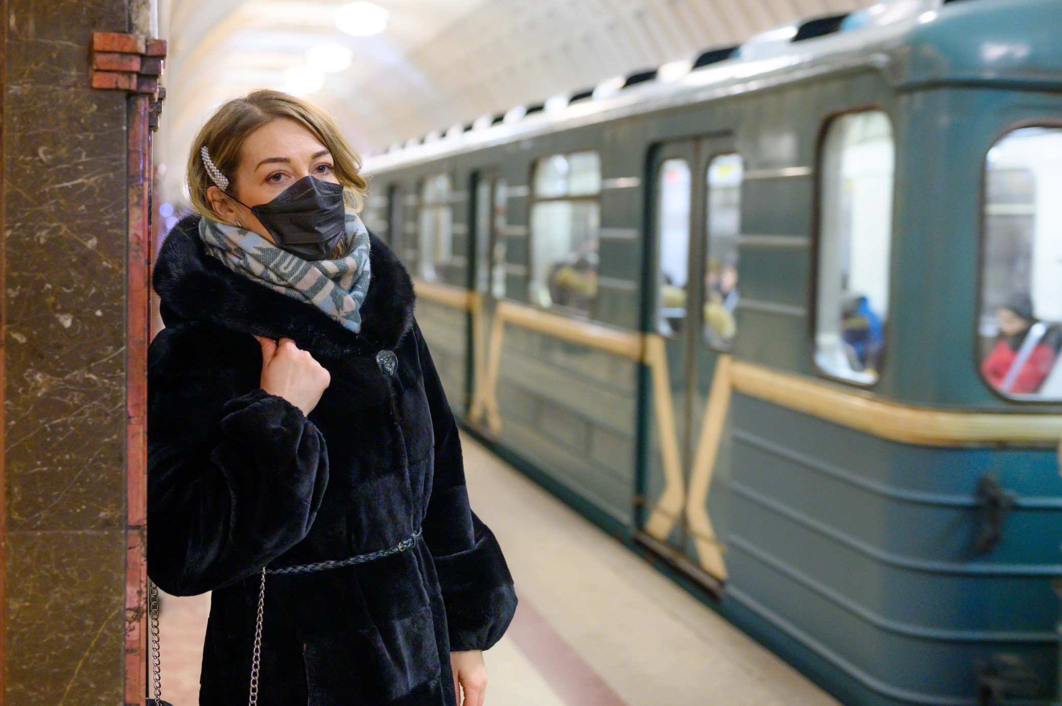 young-european-woman-in-protective-disposable-medical-black-mask-in-metro-concept-protection-of_t20_dr6j9A.jpg