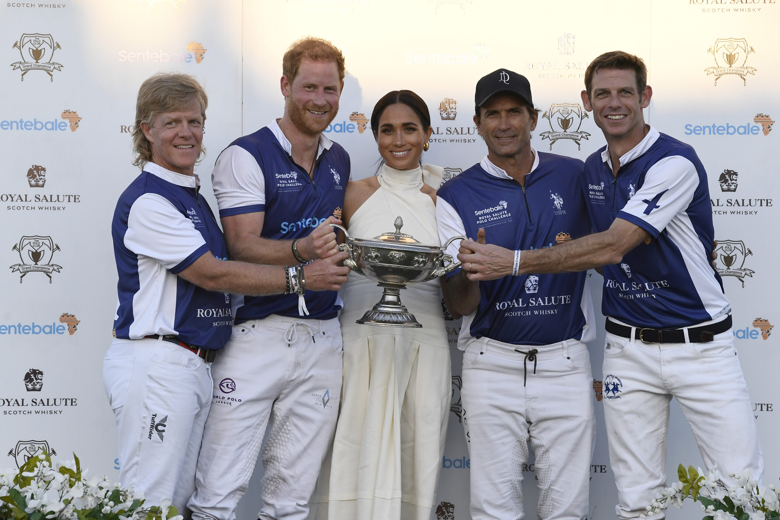 From left, Dana Barnes; Prince Harry, Duke of Sussex; Meghan, Duchess of Sussex; Adolfo Cambiaso and Malcolm Borwick during the Royal Salute Polo Challenge benefiting Sentebale at Grand Champions Polo Club on April 12, 2024, in Wellington, Florida. (Jason Koerner/Getty Images for Sentebale/TNS)