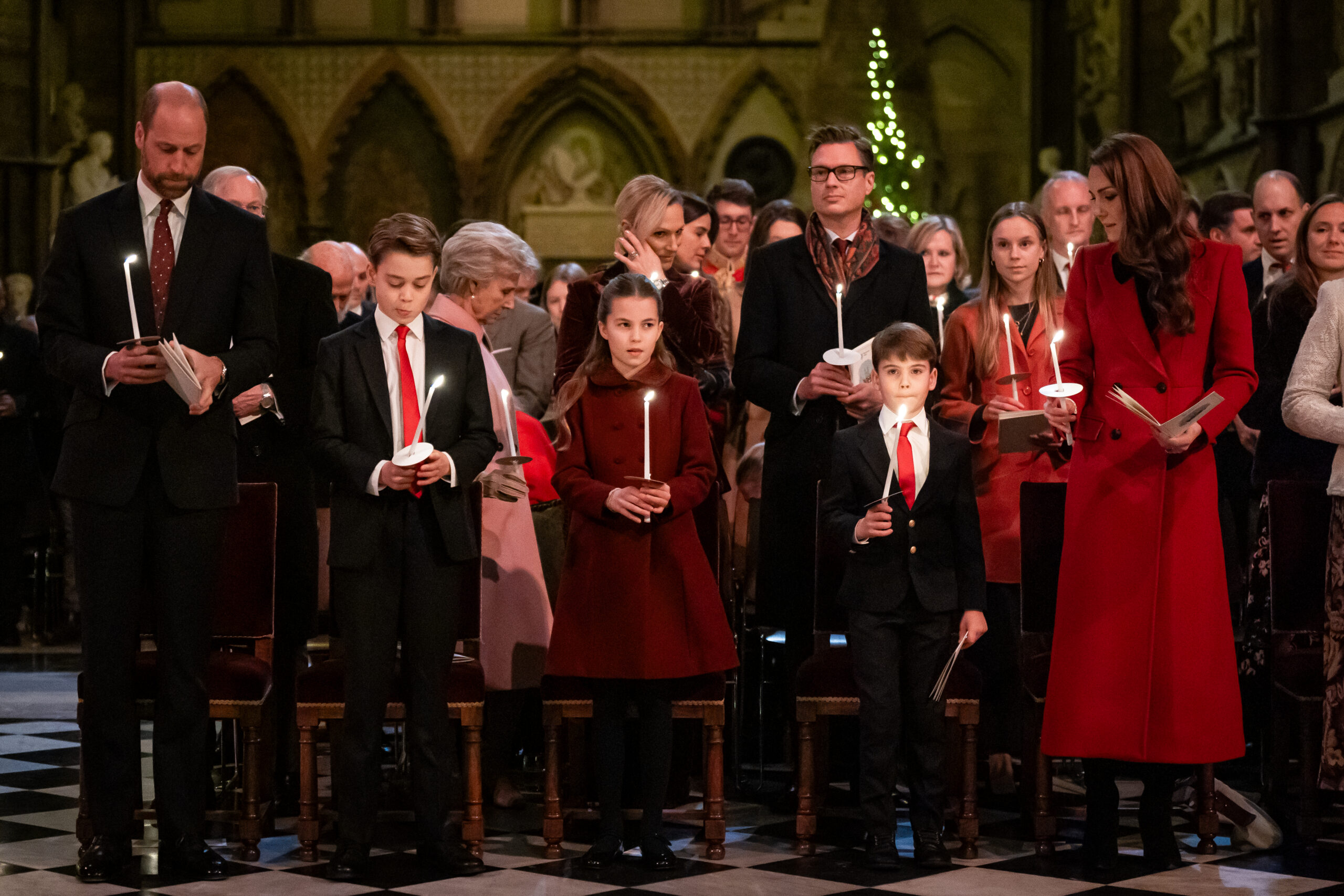 LONDON, ENGLAND - DECEMBER 6: The Prince of Wales, Prince George, Princess Charlotte, Prince Louis and Catherine, Princess of Wales during the 'Together At Christmas' Carol Service at Westminster Abbey on December 6, 2024 in London, England. The Prince and Princess of Wales, along with other members of the Royal Family, attended the annual carol service. Led by The Princess and supported by The Royal Foundation, the event offered a chance to pause and reflect on the profound values of love, compassion, and the vital connections we share—particularly during life's most challenging moments. The service also highlighted remarkable individuals from across the UK who have demonstrated extraordinary kindness, empathy, and support within their communities. (Photo by Aaron Chown - WPA Pool/Getty Images)