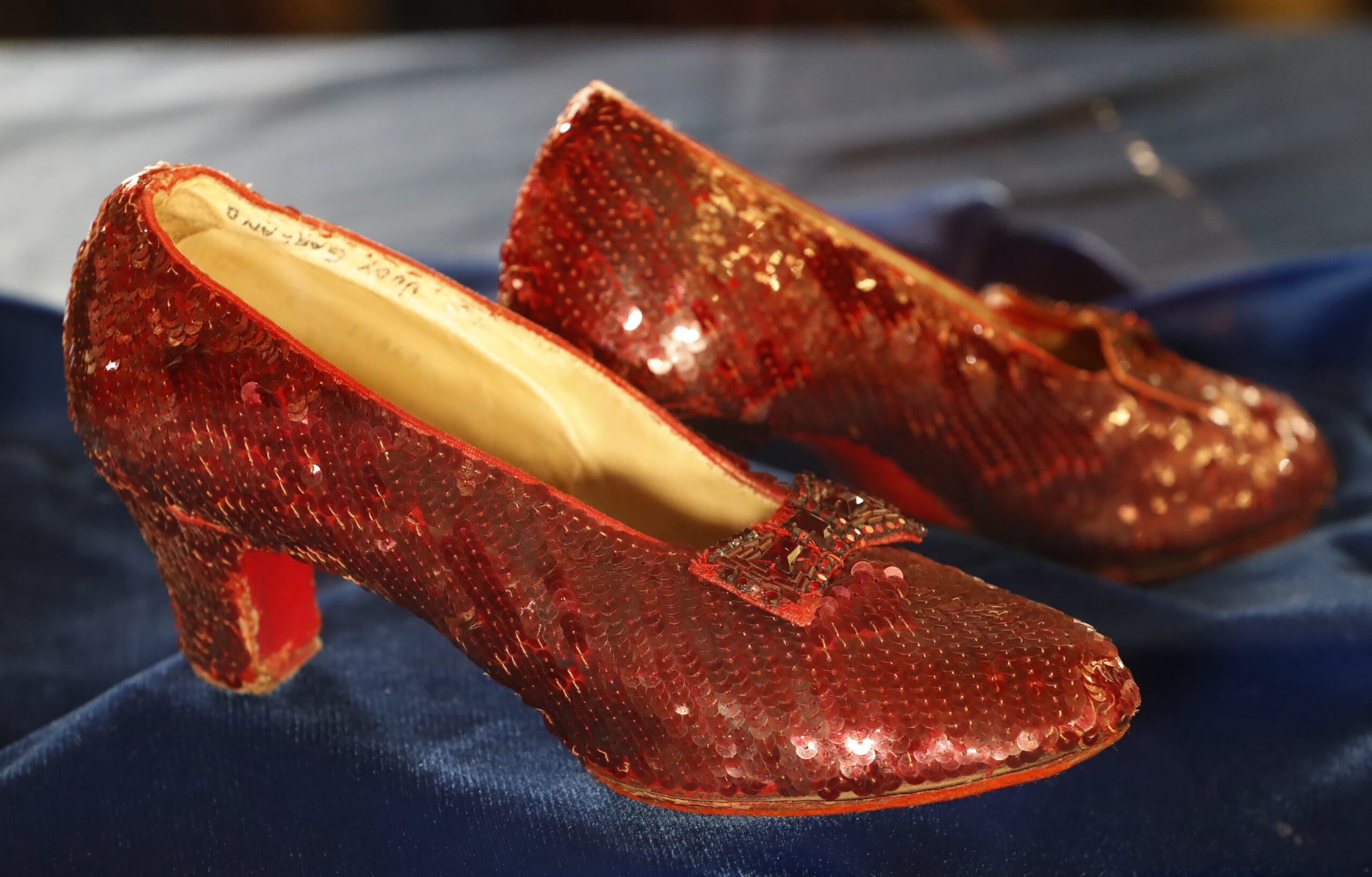 Judy Garland's ruby slippers were recovered 13 years after they went missing from the Judy Garland Museum in Grand Rapids, Minnesota. A bidder paid $28 million for the storied pair of ruby slippers worn by actor Judy Garland and featured prominently in the classic film “The Wizard of Oz,” during Heritage Auctions’ live event Saturday, Dec. 7, 2024, in Dallas.(Richard Tsong-Taatarii/Minneapolis Star Tribune/TNS)