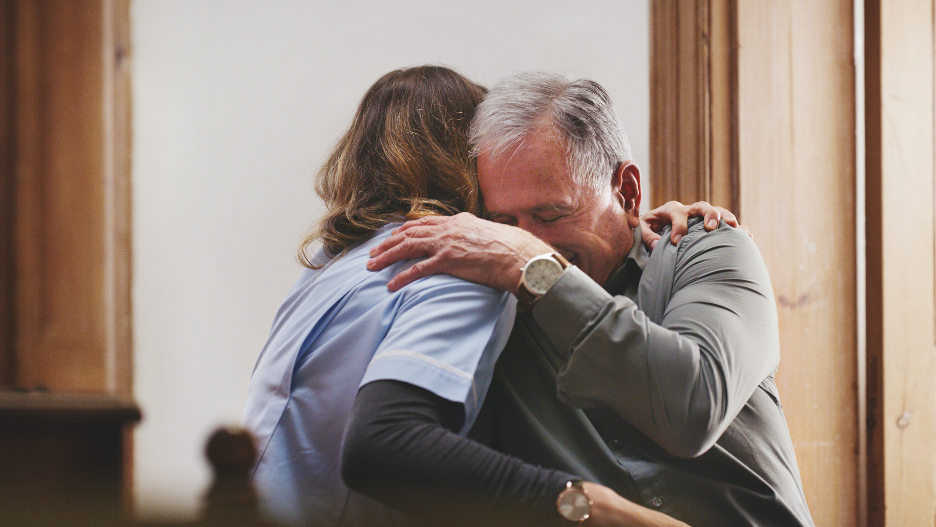 girl hugging grandfather