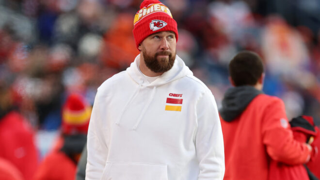 DENVER, COLORADO - JANUARY 05: Travis Kelce #87 of the Kansas City Chiefs looks on from the sideline during the game against the Denver Broncos at Empower Field At Mile High on January 05, 2025 in Denver, Colorado. (Photo by Matthew Stockman/Getty Images)