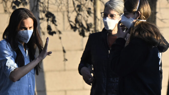 Altadena, CA - January 10: Meghan Markle, left, Duchess of Sussex member of the British royal family with two unidentified women at a home at 2858 Highview Ave. and Altadena Dr. that was destroyed during the Eaton Fire in Altadena on Friday, January 10, 2025.(Photo by Keith Birmingham/MediaNews Group/Pasadena Star-News via Getty Images)