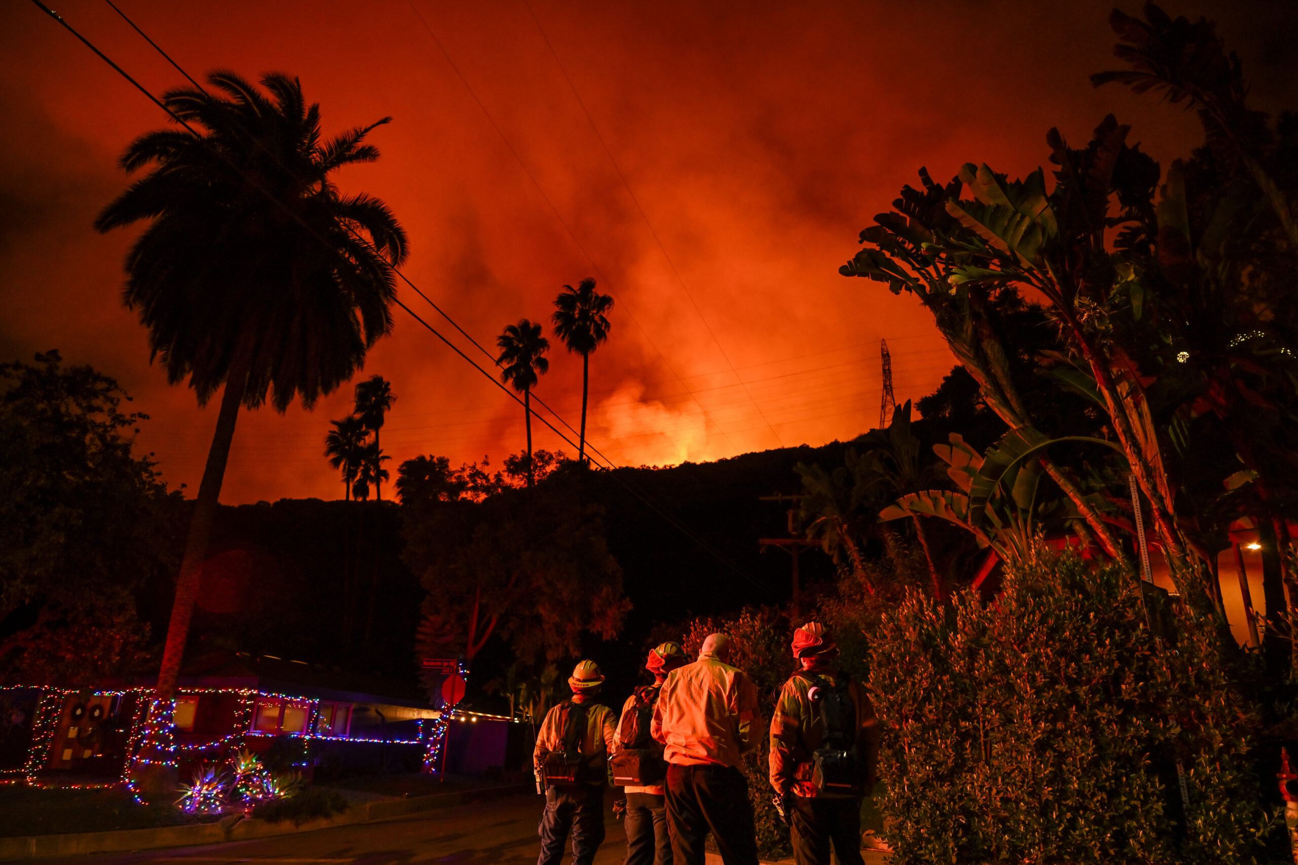 CALIFORNIA, USA - JANUARY 10: A view of wild fire as firefighting planes and helicopters drop water over flames in Mandeville Canyon during 'Palisades Fire' in Los Angeles, California, United States on January 10, 2025. (Photo by Tayfun Coskun/Anadolu via Getty Images)