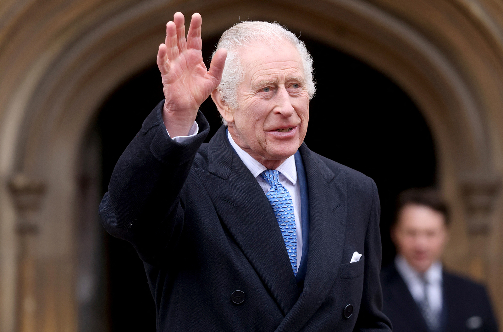 King Charles III waves as he leaves after attending the Easter Mattins Service at at St. George's Chapel, Windsor Castle on March 31, 2024, in Windsor, England. King Charles and Prince William say they will not attend the funeral of former U.S. President Jimmy Carter. (Hollie Adams/WPA Pool/Getty Images/TNS)