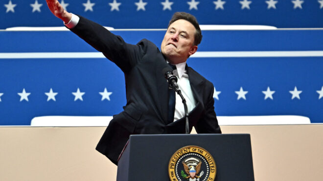 Tesla and SpaceX CEO Elon Musk gestures as he speaks during the inaugural parade inside Capitol One Arena, in Washington, D.C., on Monday, Jan. 20, 2025. (Angela Weiss/AFP/Getty Images/TNS)