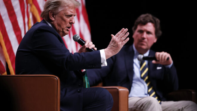 President Donald Trump sits down for a conversation with Tucker Carlson during his Live Tour at the Desert Diamond Arena on Oct. 31, 2024, in Phoenix, Arizona. (Chip Somodevilla/Getty Images/TNS)