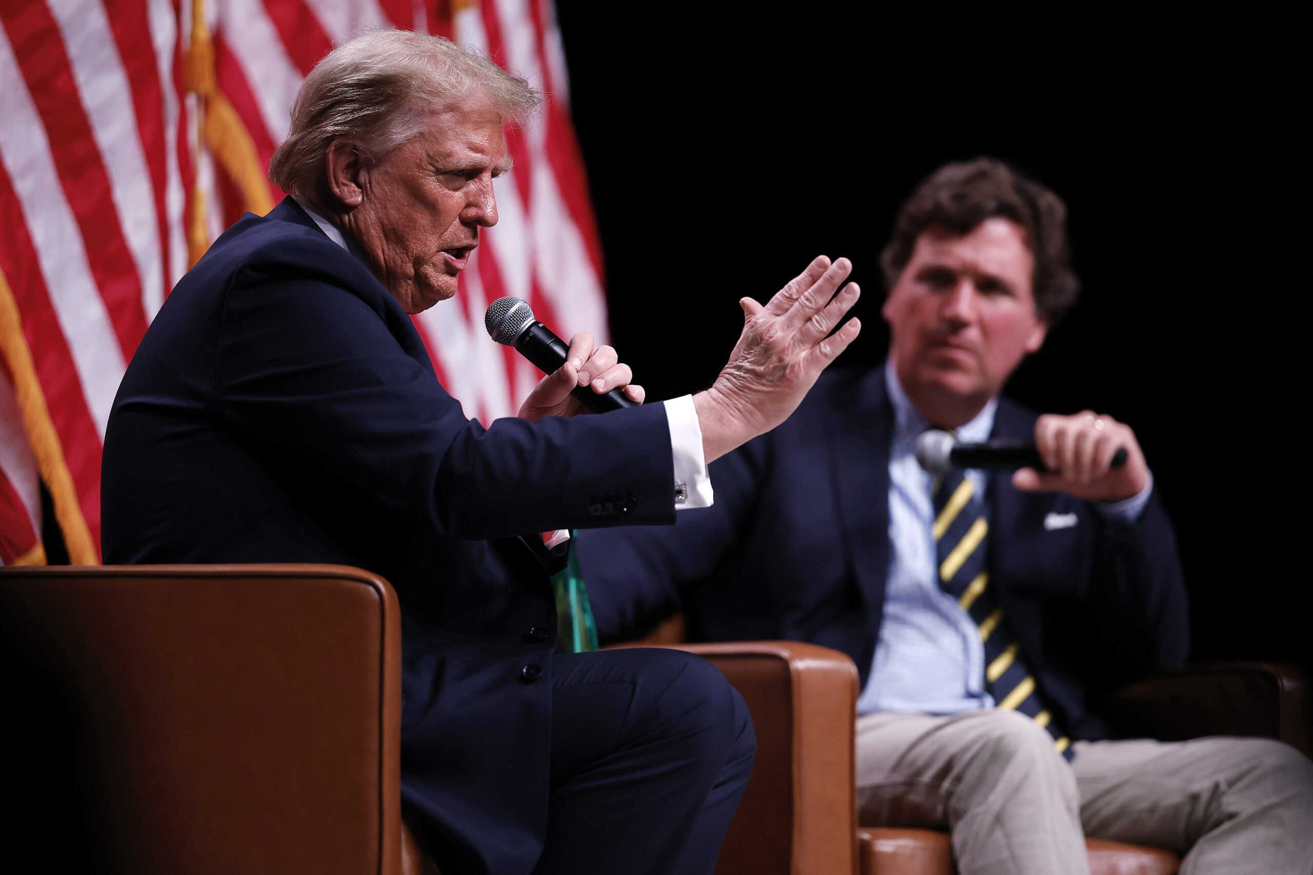 President Donald Trump sits down for a conversation with Tucker Carlson during his Live Tour at the Desert Diamond Arena on Oct. 31, 2024, in Phoenix, Arizona. (Chip Somodevilla/Getty Images/TNS)